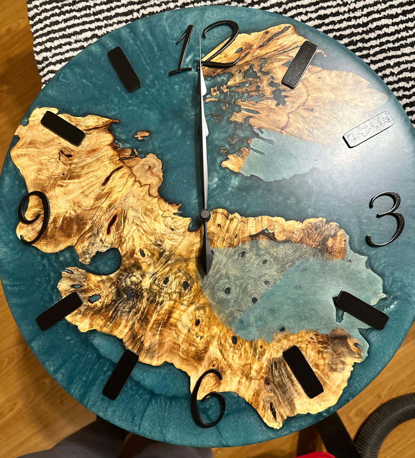 18" round clock with wood design and blue epoxy